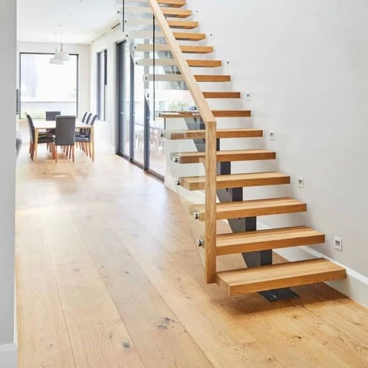 Modern interior with wooden floating staircase
